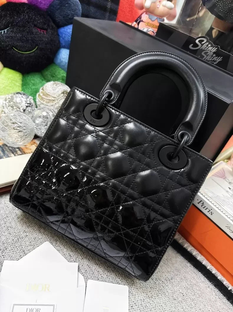 Dior Lady Dior bag in matte black with calfskin and patent leather accents